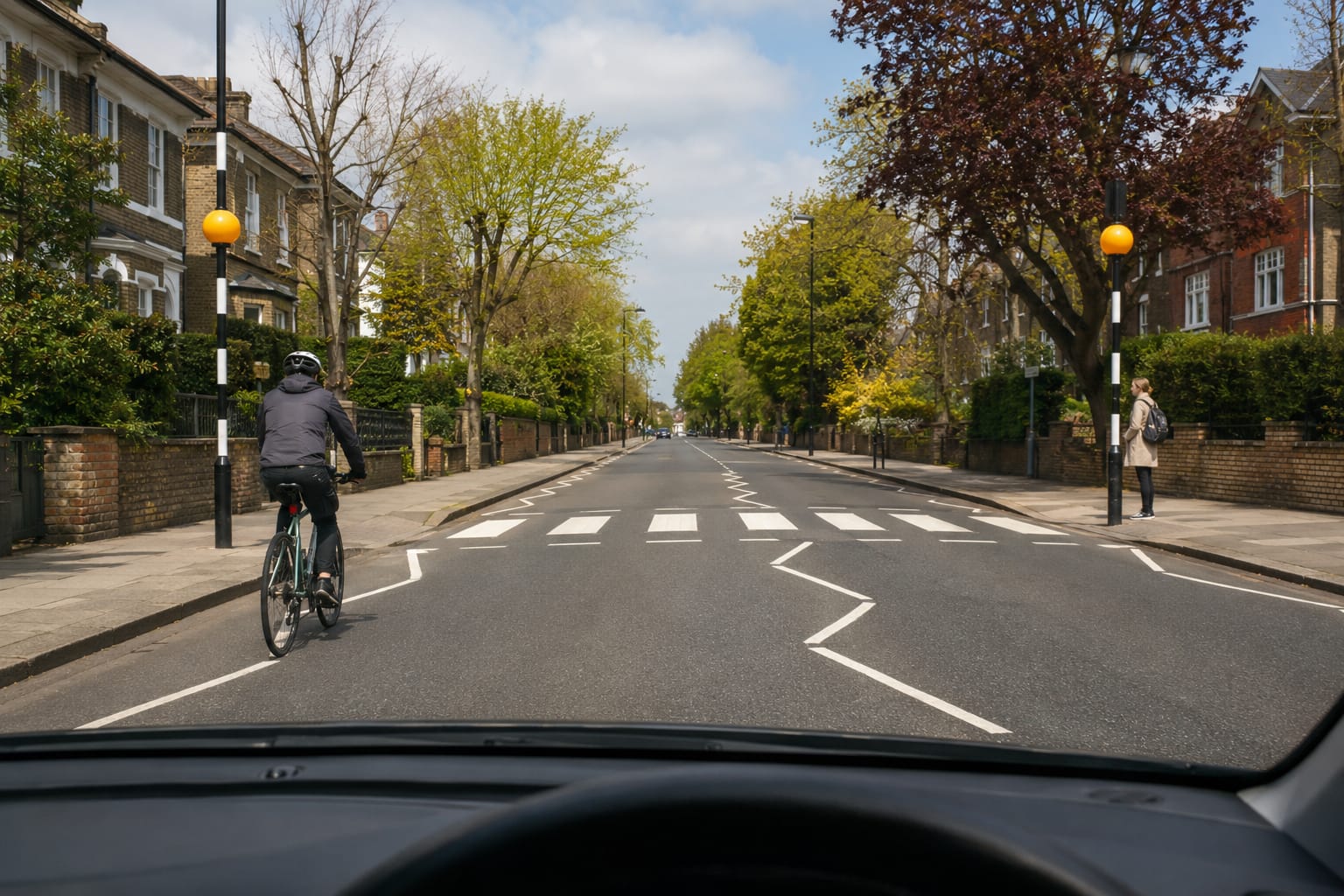 View from a learner car showing developing hazards on a UK road